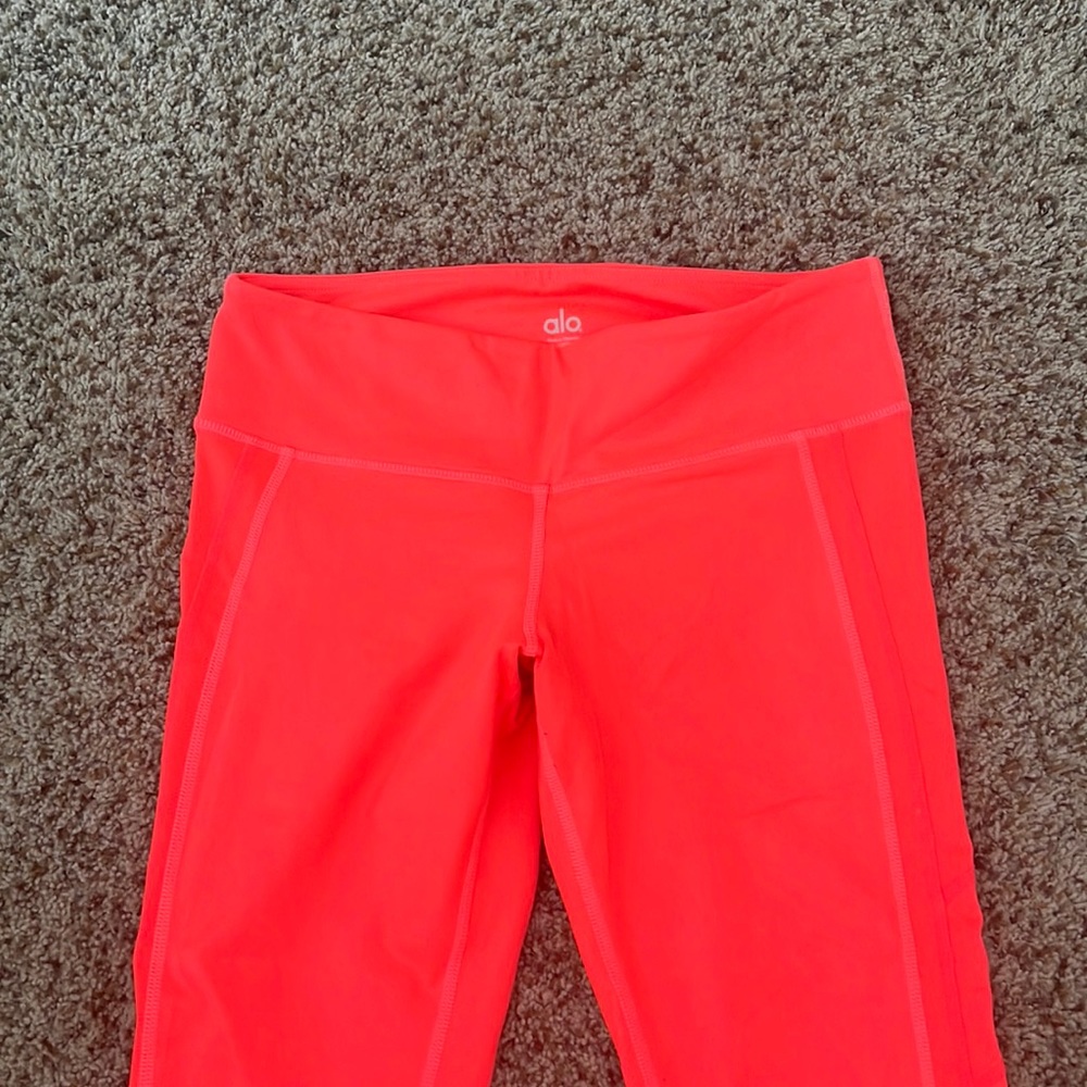 Bright neon orange leggings